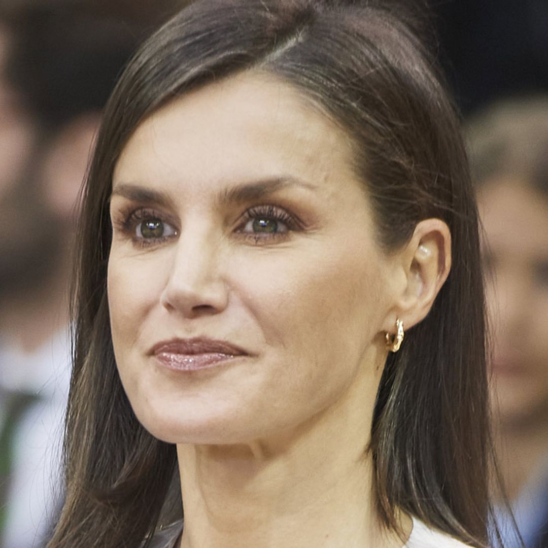 Queen Letizia delights fans by recycling a cream Hugo Boss outfit for the basketball