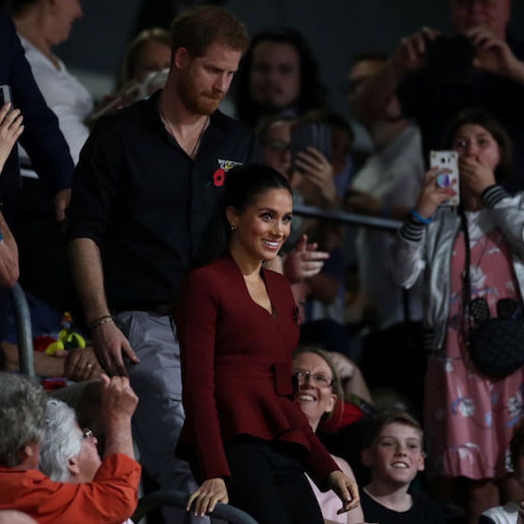 Duchess Meghan is chic in crimson as she watches Invictus basketball final with Prince Harry