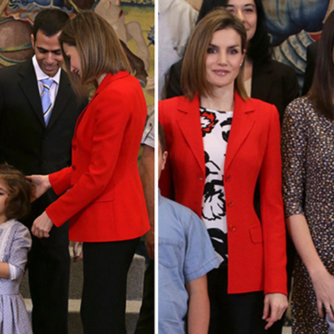 Queen Letizia charms a little girl during a meeting at Zarzuela Palace