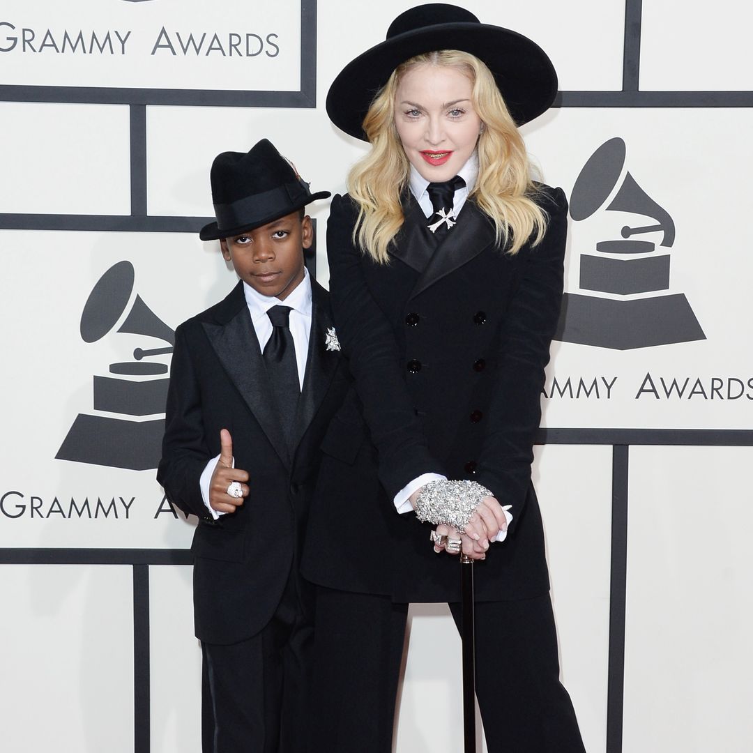 A young David posing with Madonna in matching fedoras and suits on the Grammys red carpet