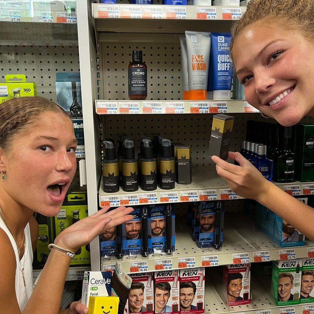 Michael Strahan's teenage daughters cheered on their famous dad at CVS