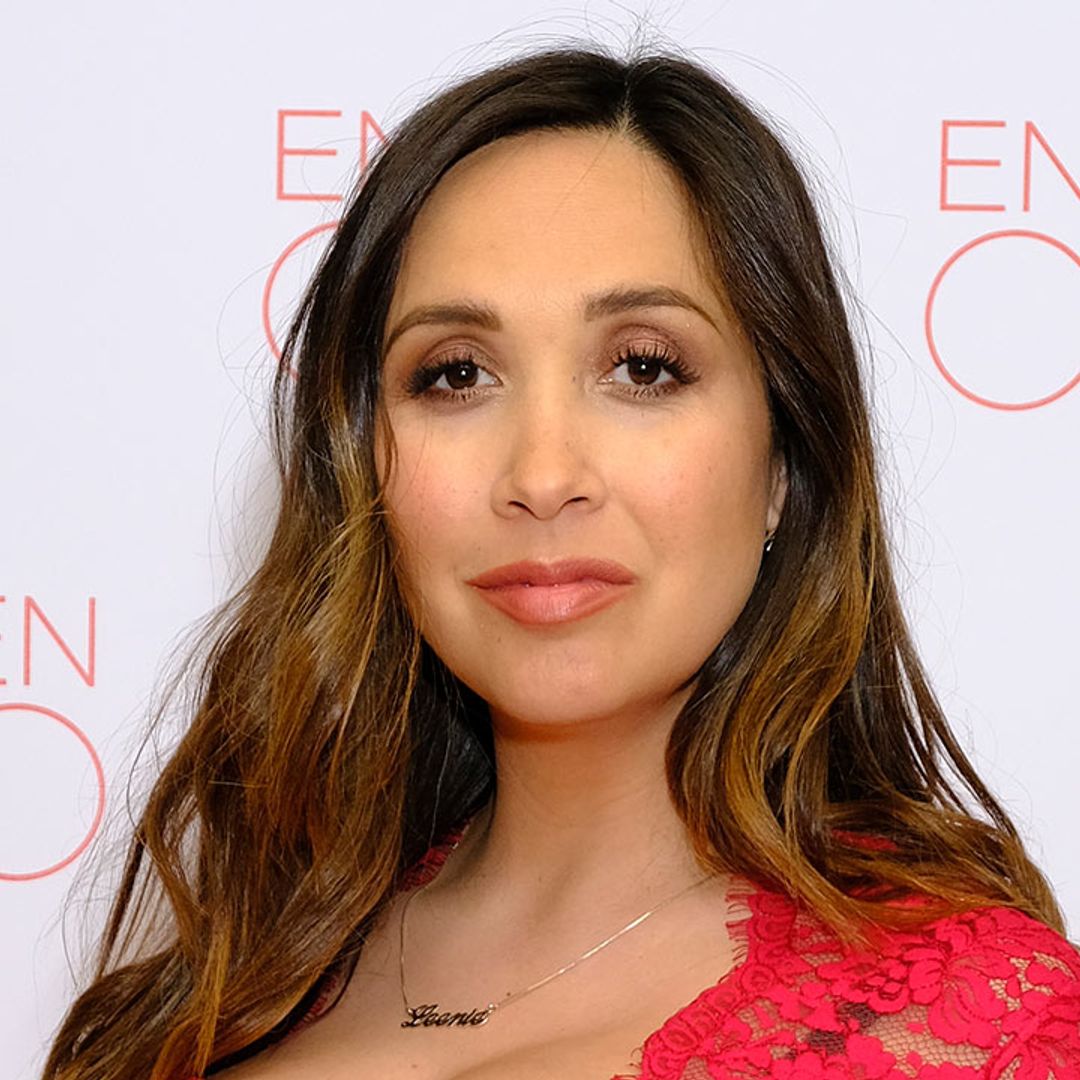 Myleene Klass covers bump in incredible floor-length red gown for a night out with her boyfriend