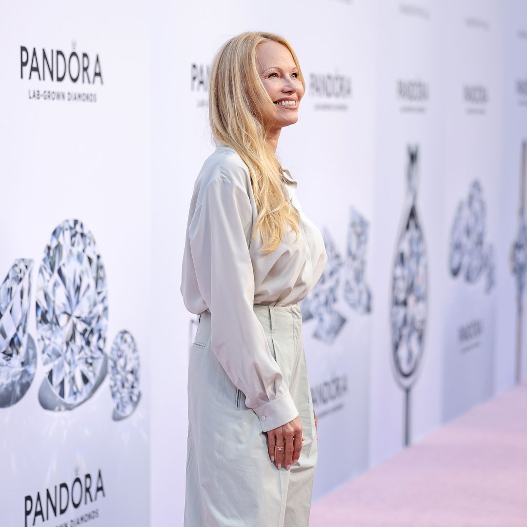 Glamorous Pamela Anderson poses with rarely seen sons for special occasion