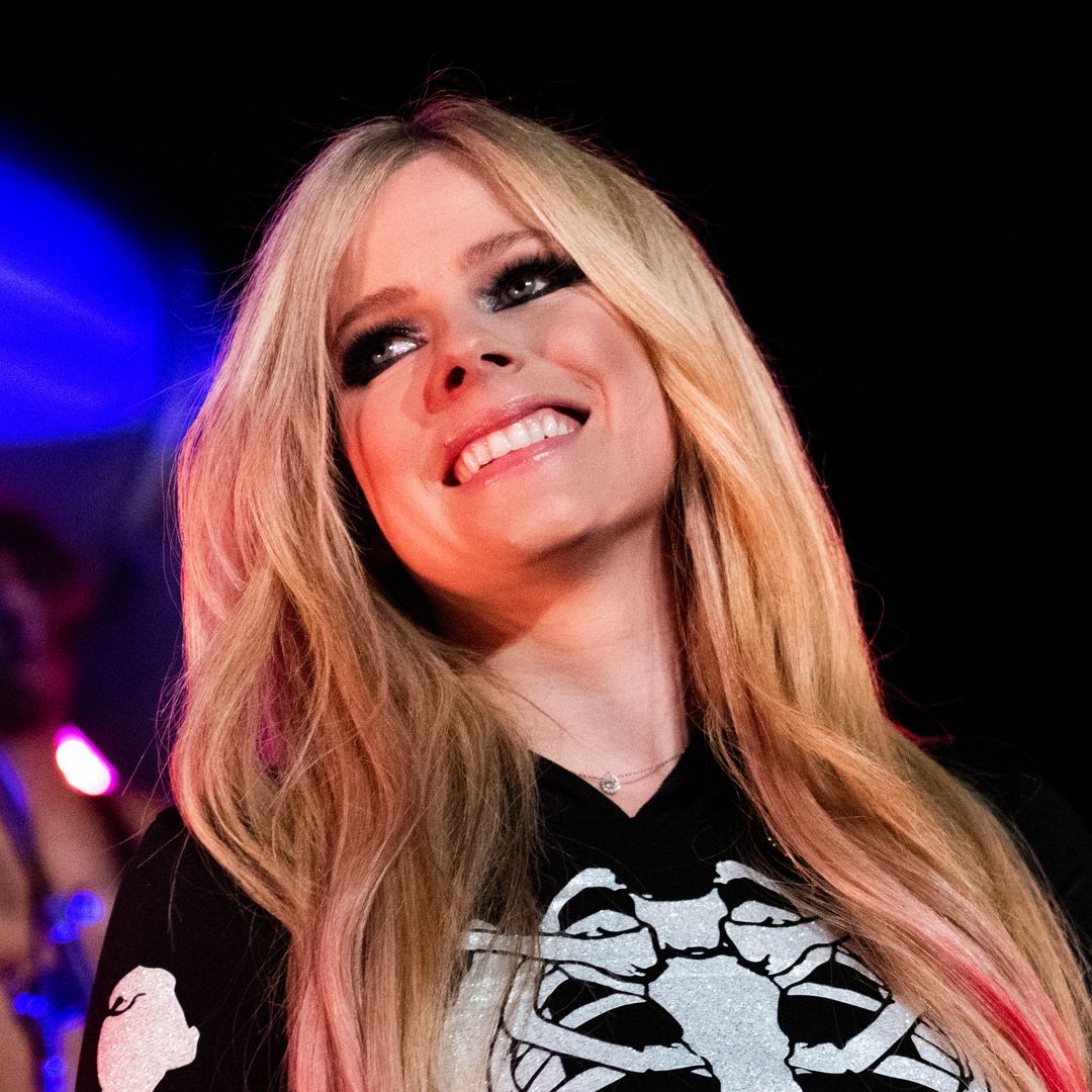 Avril Lavigne rocks fishnets and harness skirt as she's joined by new boyfriend Tyga on tour