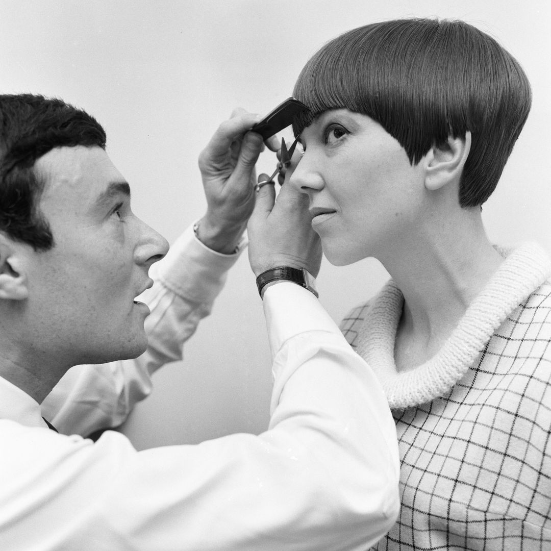Fashion designer Mary Quant seen here having the finishing touches made to her new hairstyle by Vidal Sassoon 12th November 1964 (Photo by Daily Mirror/Mirrorpix/Mirrorpix via Getty Images)