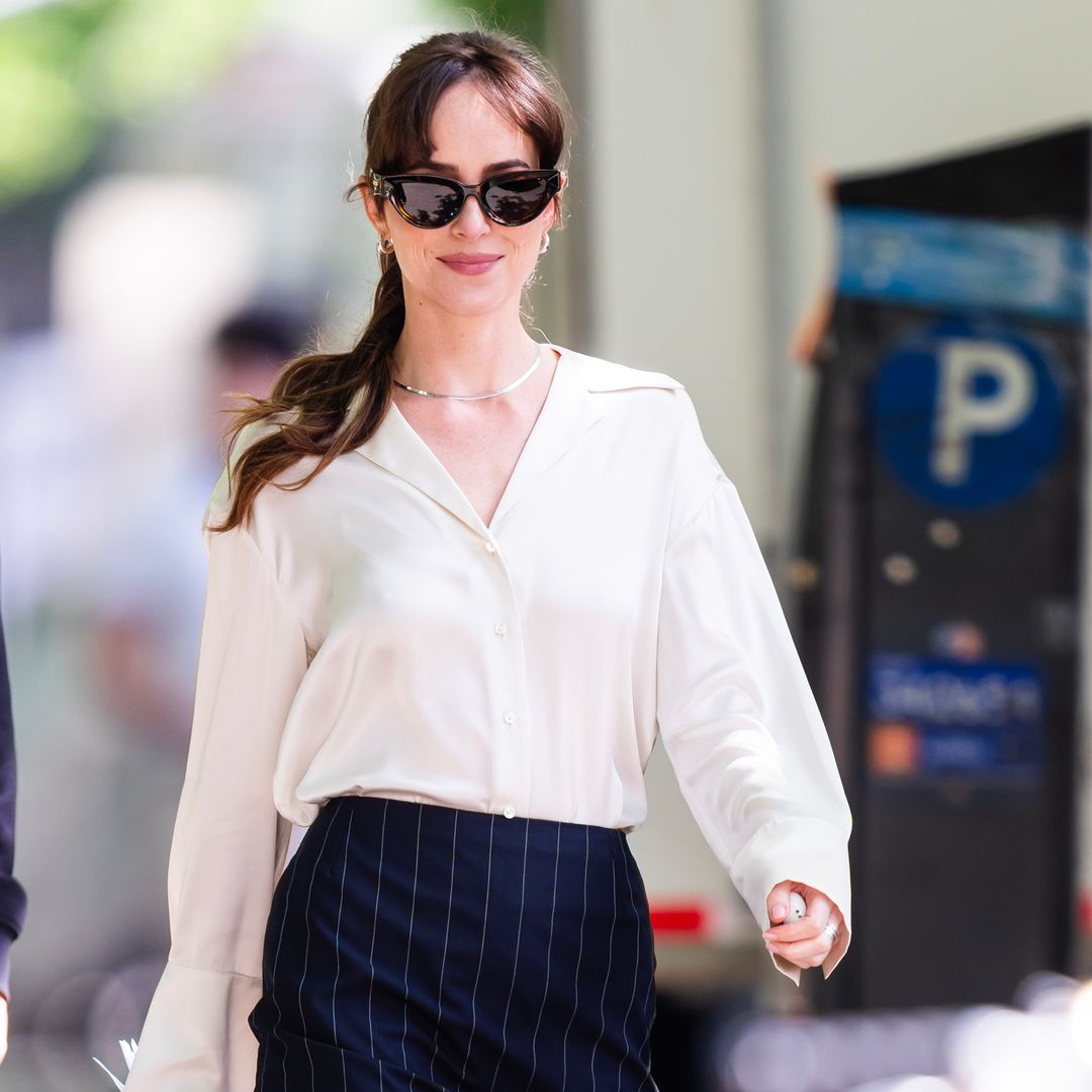 Dakota Johnson’s Adidas and sheer tights combo is perfect for unpredictable spring weather