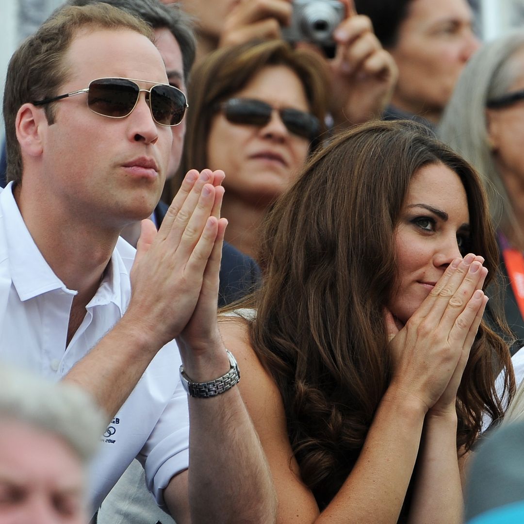  Prince William and Princess Kate watching sport with their hands near their mouths