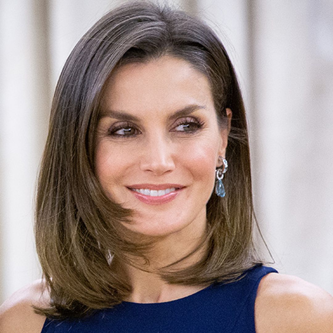 Queen Letizia channels Duchess Meghan in stunning blue pleated dress – see photo