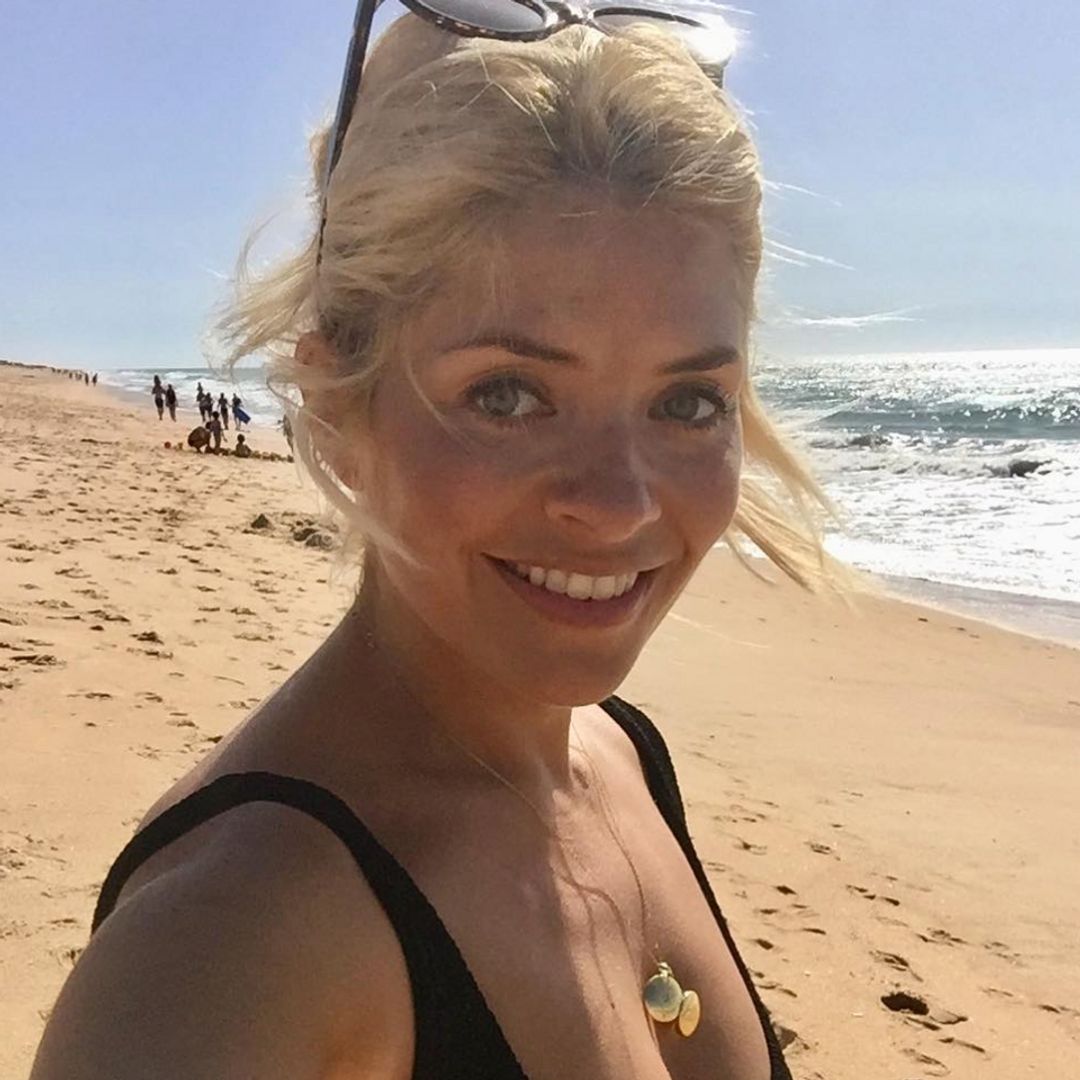 Holly Willoughby is a goddess in chic black swimsuit in Portugal - shop the look