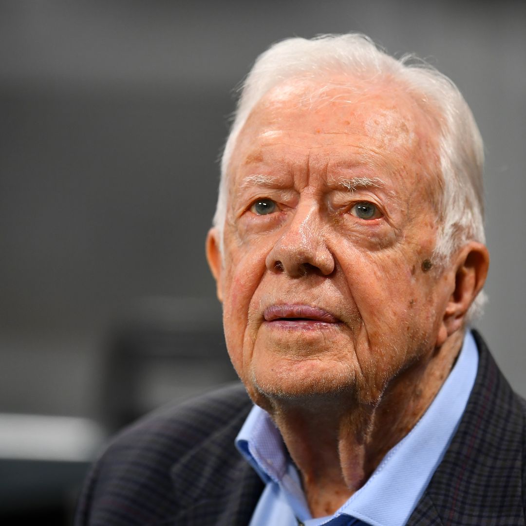 Jimmy Carter, 98, met with applause as he makes rare appearance with wife amid hospice care