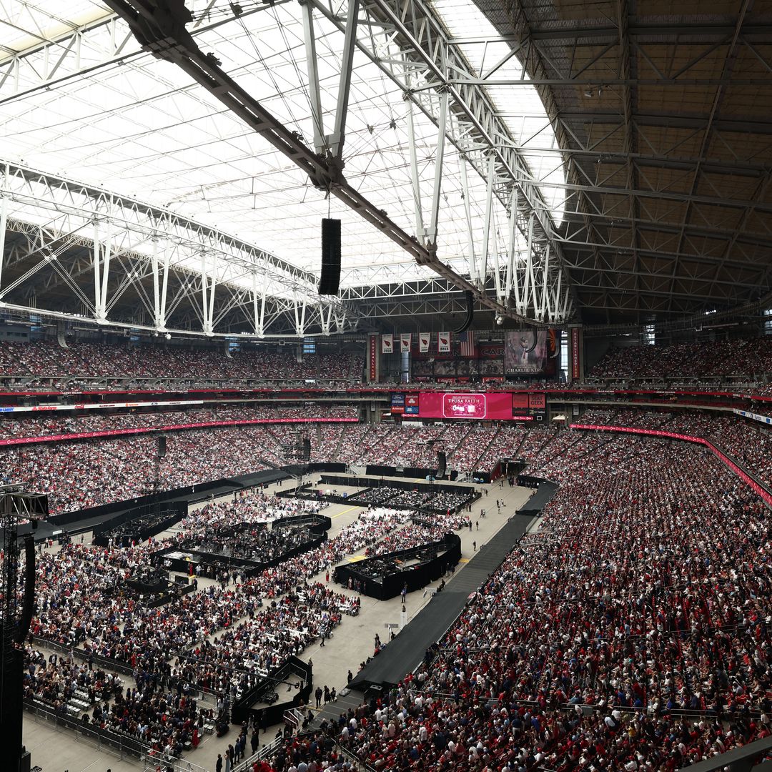 People attend the public memorial service for right-wing activist Charlie Kirk at State Farm Stadium in Glendale, Arizona, on September 21, 2025