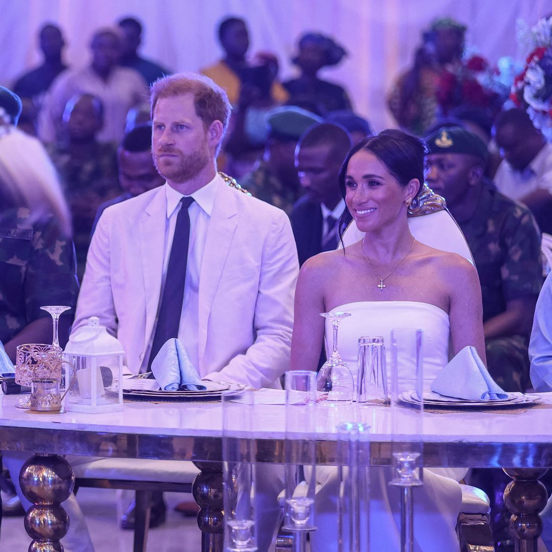Blissful Prince Harry and Meghan Markle look like a bride and groom on day two of Nigeria trip