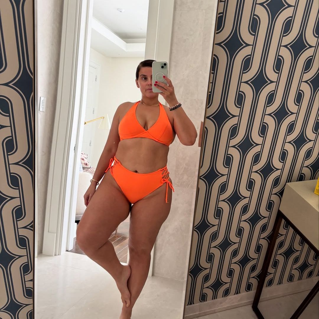 Nelly Furtado poses for a mirror selfie wearing an orange string bikini, shared on Instagram