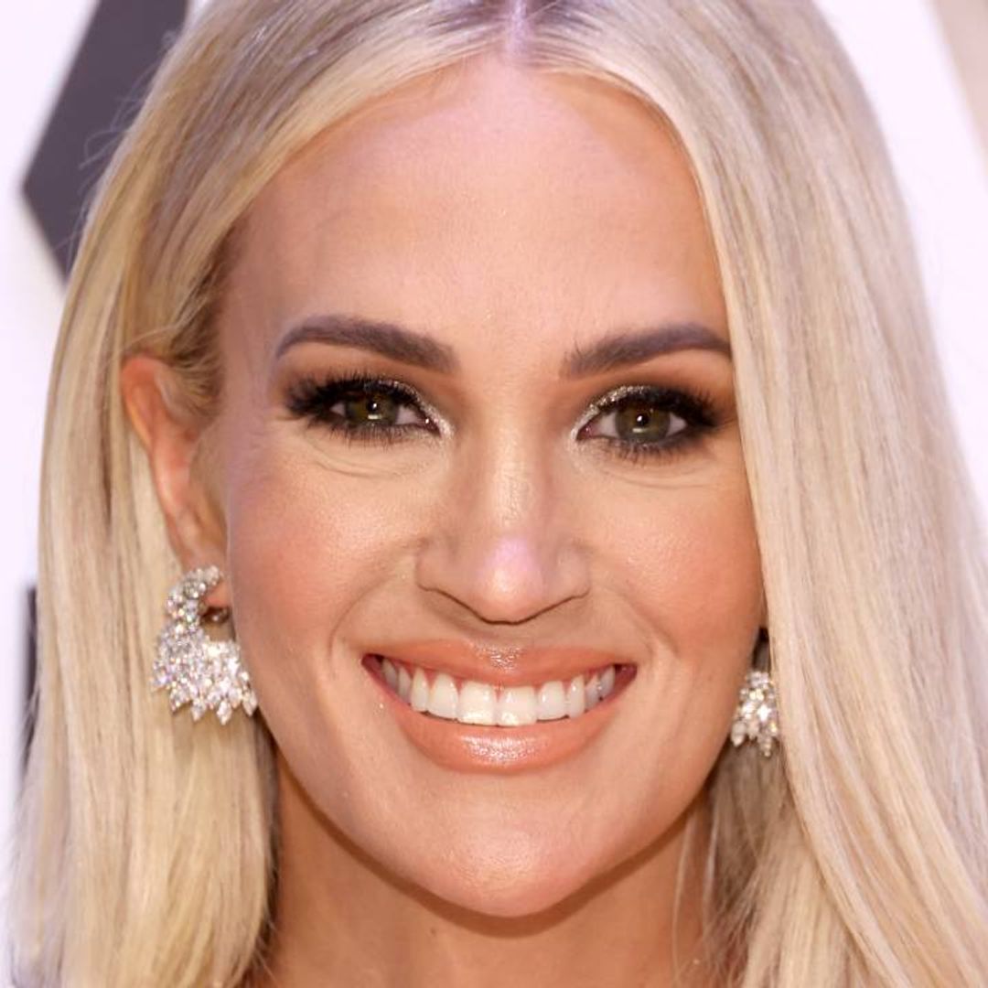 Carrie Underwood wows fans in bold red carpet look at CMA Awards