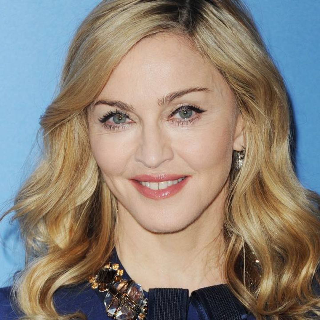 Madonna's twins decorate three gingerbread houses in cheeky family video
