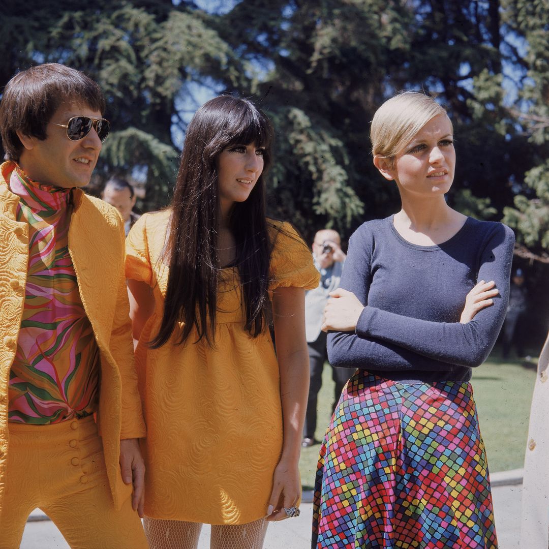 Twiggy (right) with American singing duo Sonny Bono (1934 - 1998) and Cher at an outdoor party given to welcome Twiggy to Los Angeles, Beverly Hills, April 30, 1967