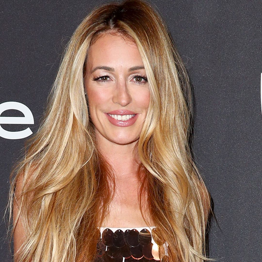 Cat Deeley puts on a flirty display in chic white bikini and colourful cover-up during LA getaway