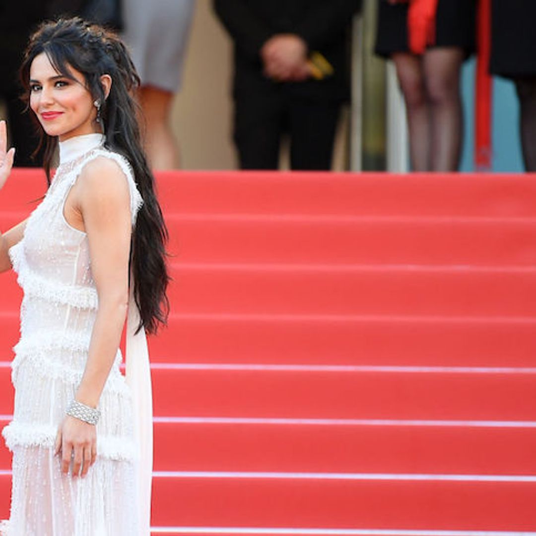 Cheryl stuns in white gown at Cannes Film Festival