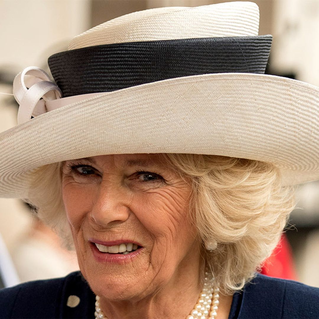 The Duchess of Cornwall is girly in a pretty pink coat - with a crystallised poppy