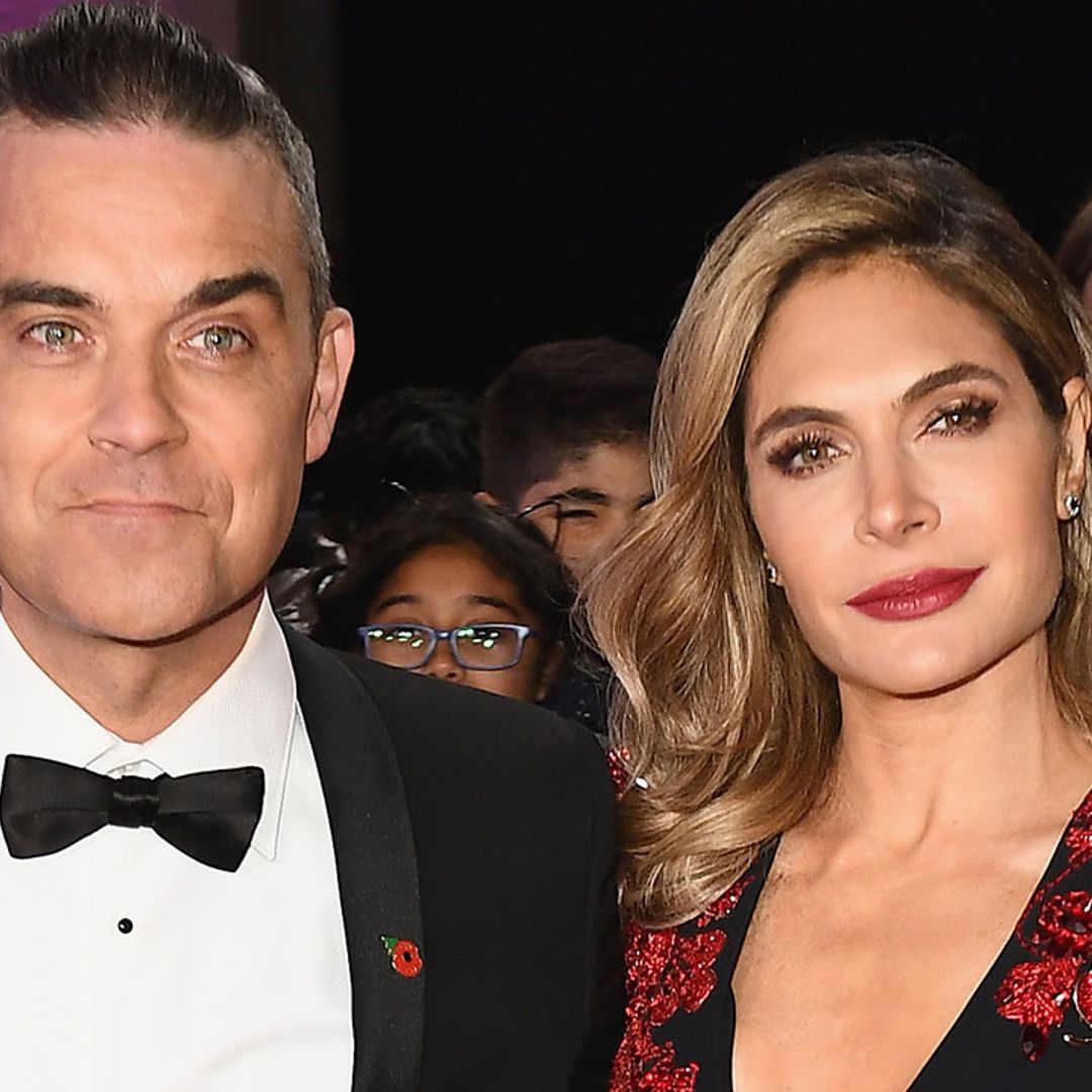 Robbie Williams is every inch the doting dad in heart-melting photo with both daughters