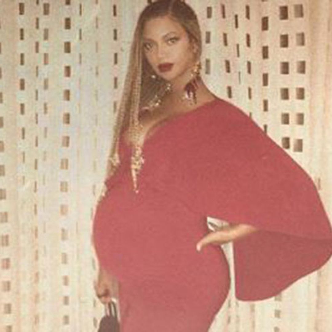 Beyoncé shows off blossoming baby bump in stunning red gown
