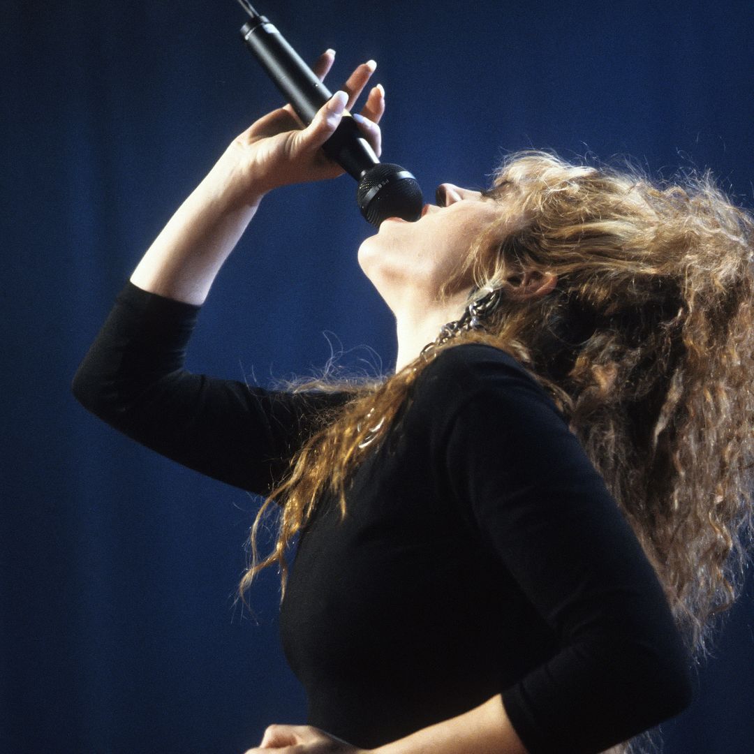 80's music icon, 63, glows in make-up free bikini shot