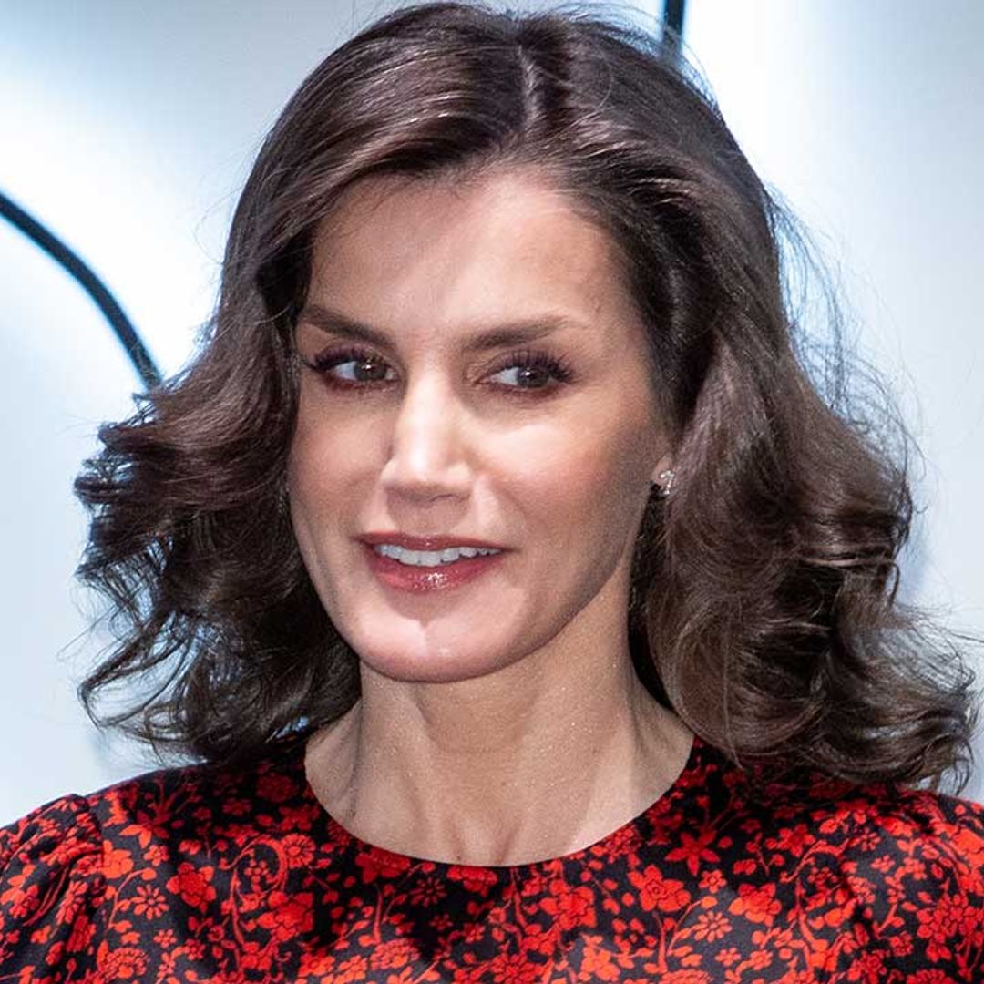 Queen Letizia sports wavy hair as she steps out in red floral Maje dress in Madrid