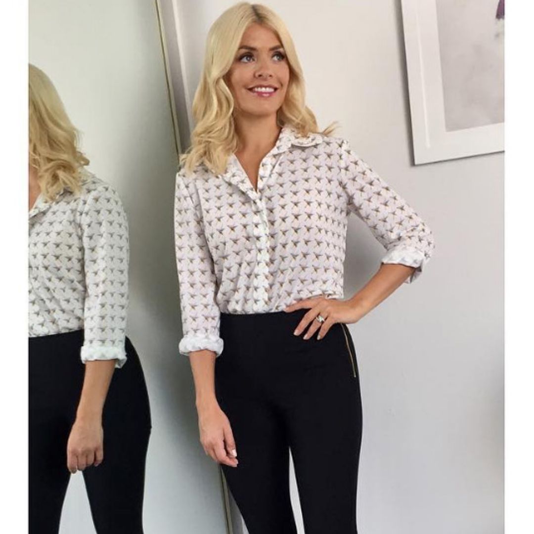 Holly Willoughby looks incredible in a £65 star-print blouse and skinny black trousers