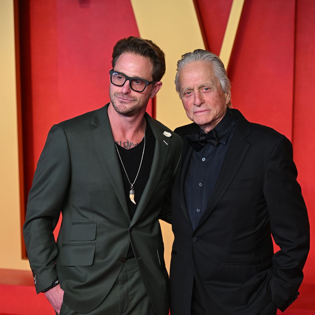 Michael Douglas, 79, looks incredibly youthful as he steps out with lookalike son Cameron to Vanity Fair Oscar Party