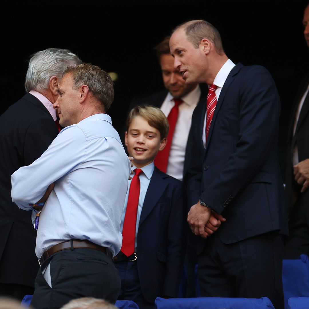 Prince George smiles from ear to ear as he joins Prince William to watch the rugby in royal first