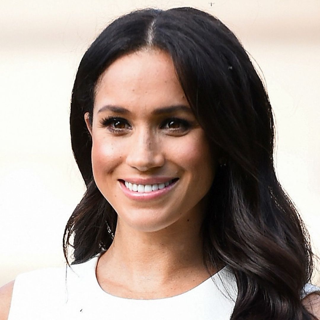 Meghan Markle dresses baby bump in white as she reveals due date