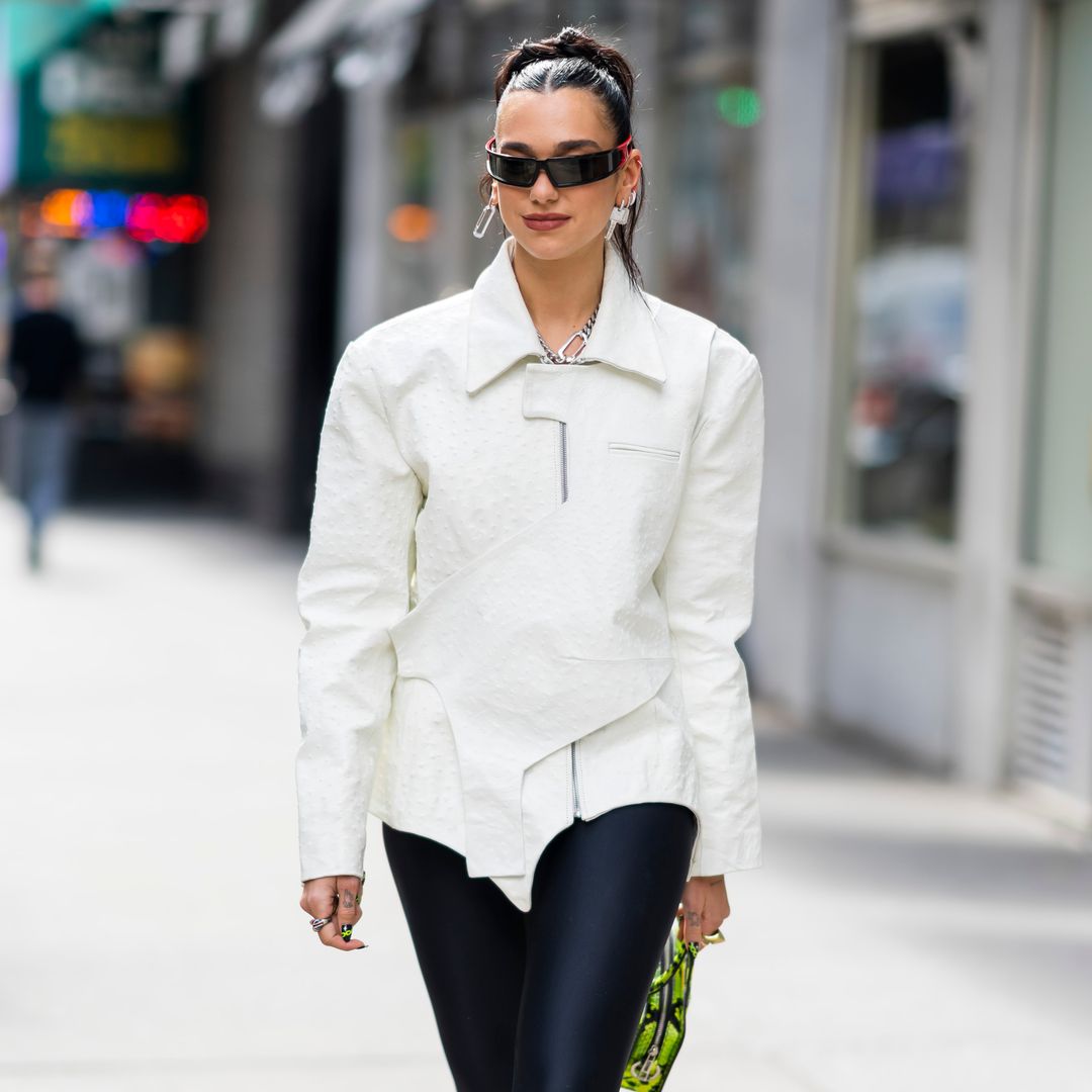 Dua Lipa dazzles in lace-up corset shirt and capri pants 