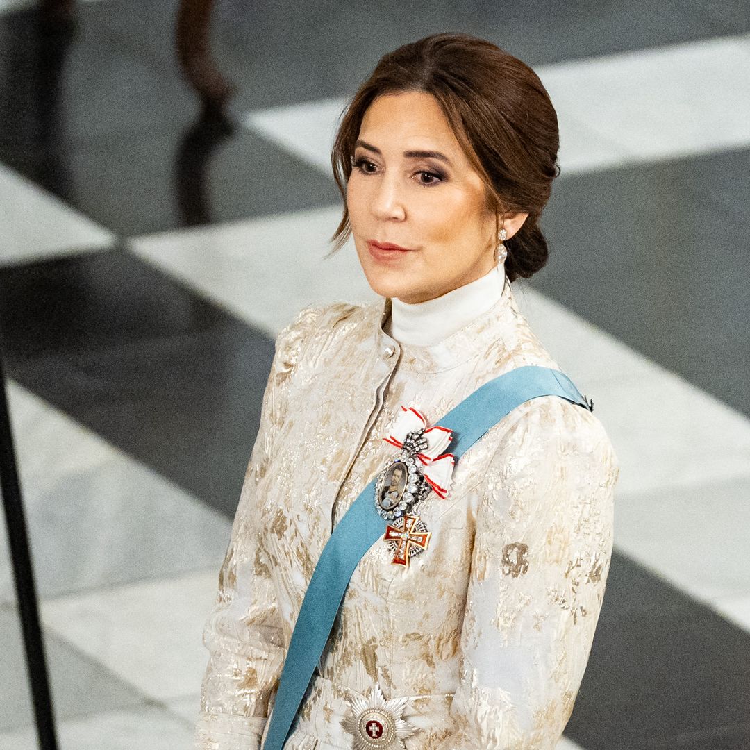 Queen Mary puts on 'show of solidarity' with significant gold brocade dress