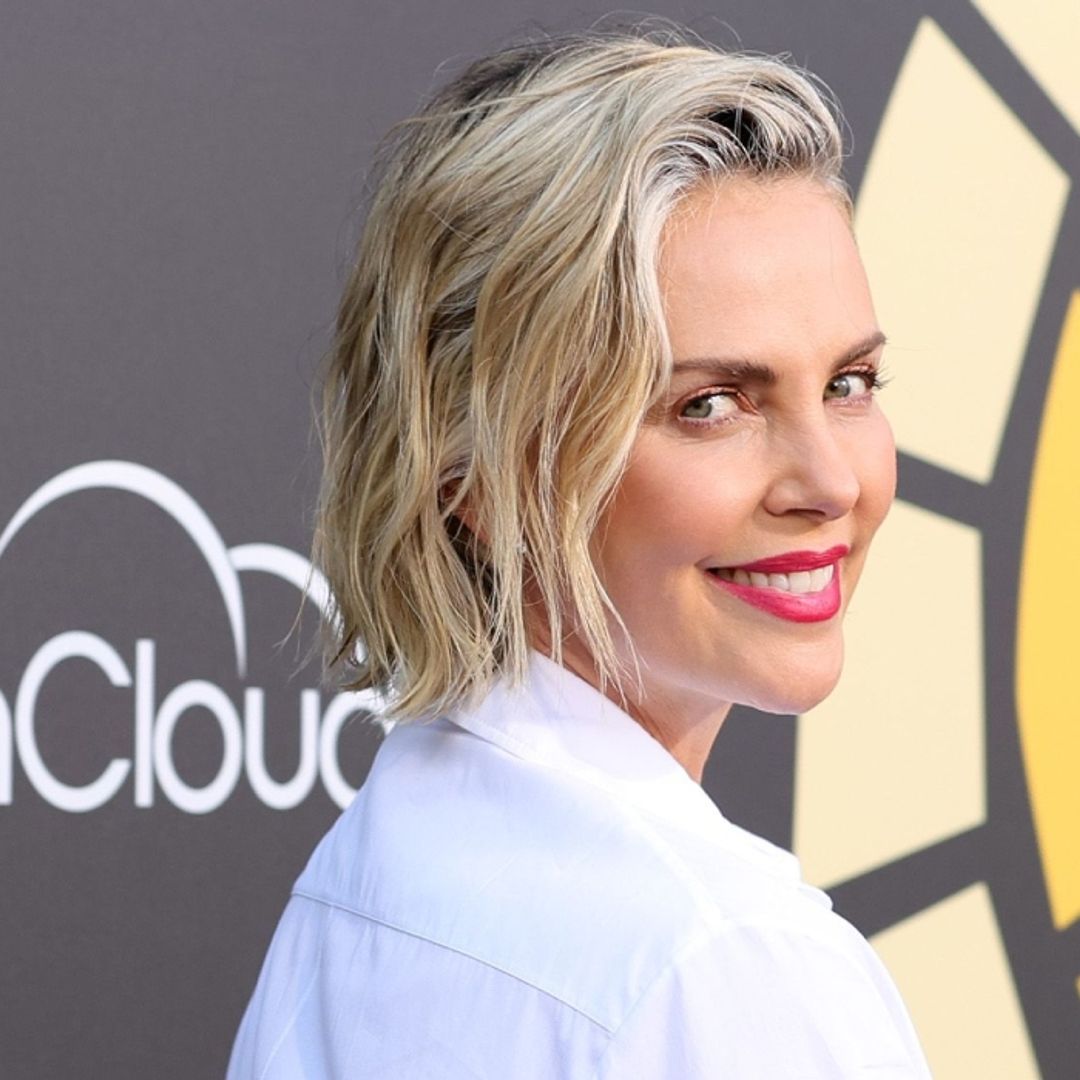 Charlize Theron has a ball in very rare seaside video with her daughters