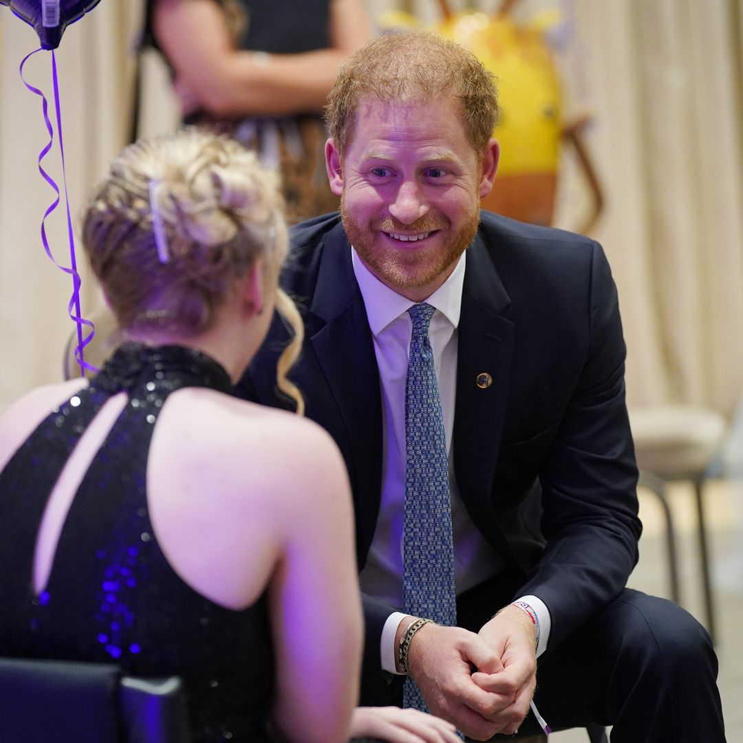Prince Harry says late Queen 'looking down on us' 