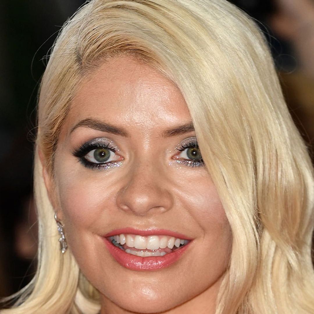 Holly Willoughby braves a halterneck dress for Jubilee open-top bus - watch