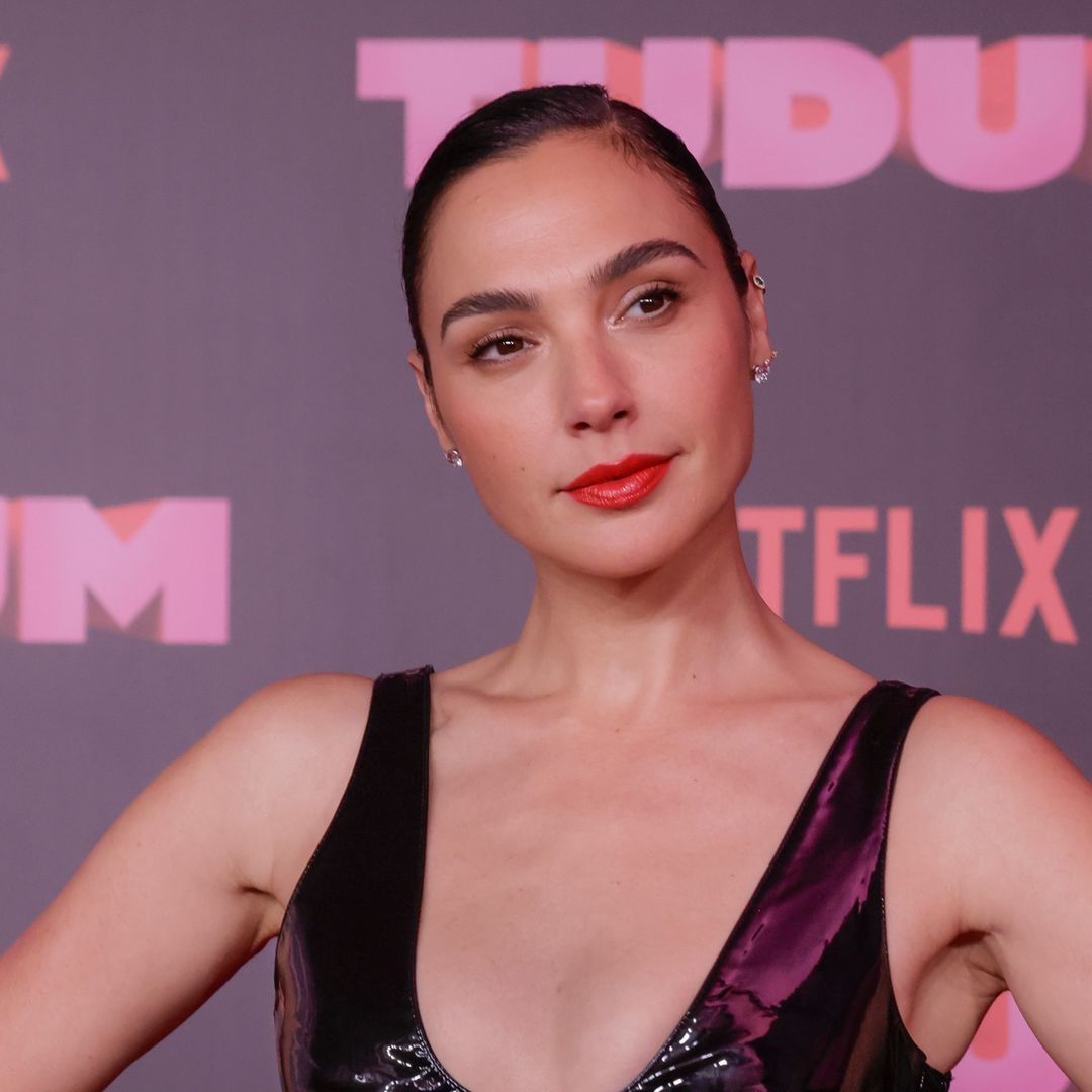 Gal Gadot displays svelte physique in skin tight plunging leather dress for huge event