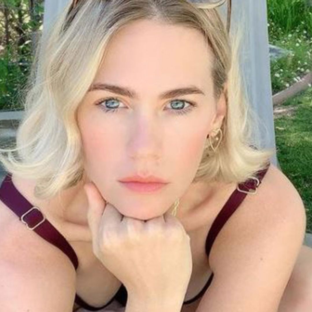 January Jones showcases incredible figure in plunging swimsuit - and fans are lost for words!