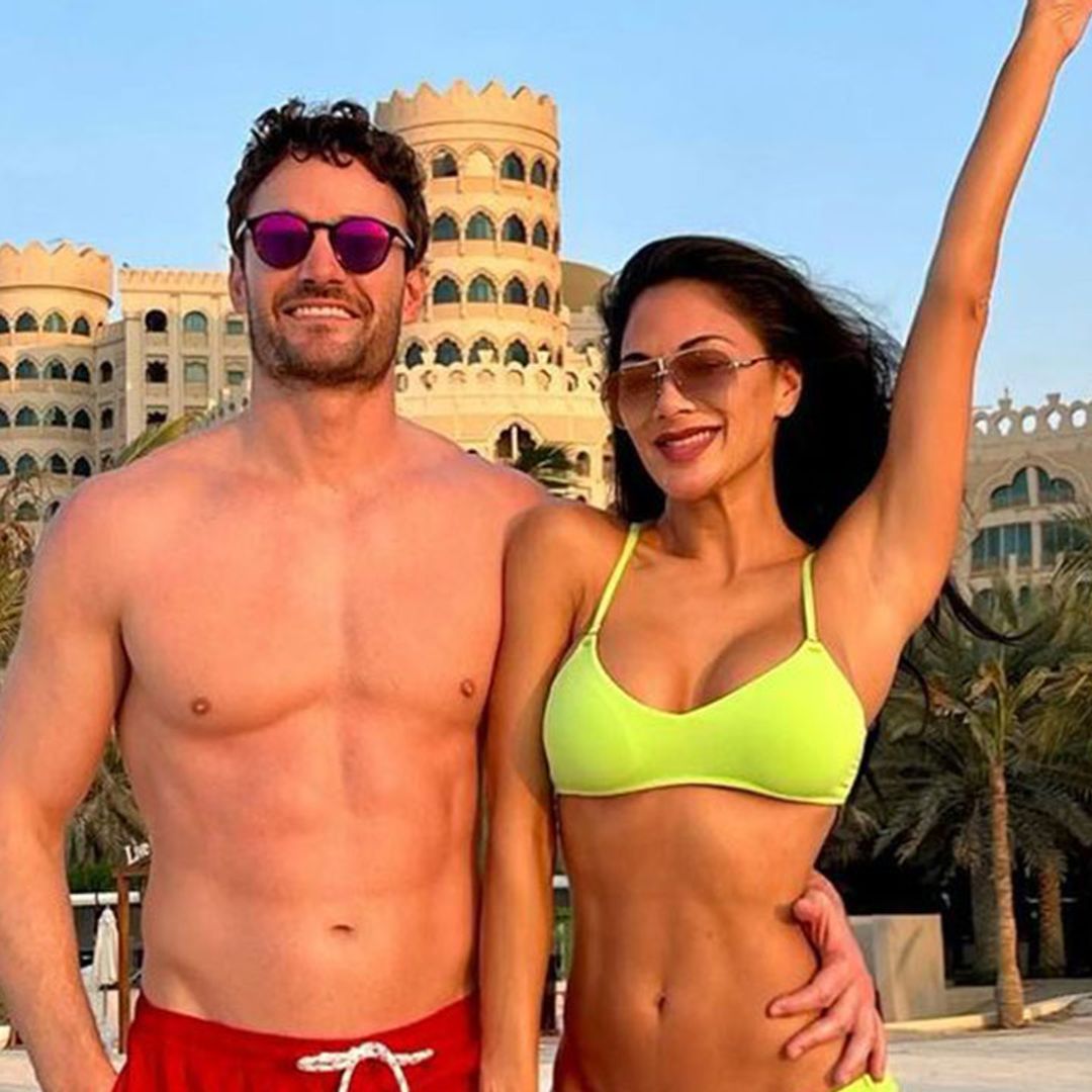 Nicole Scherzinger commands attention in sizzling bikini as she frolics on the beach with Thom Evans