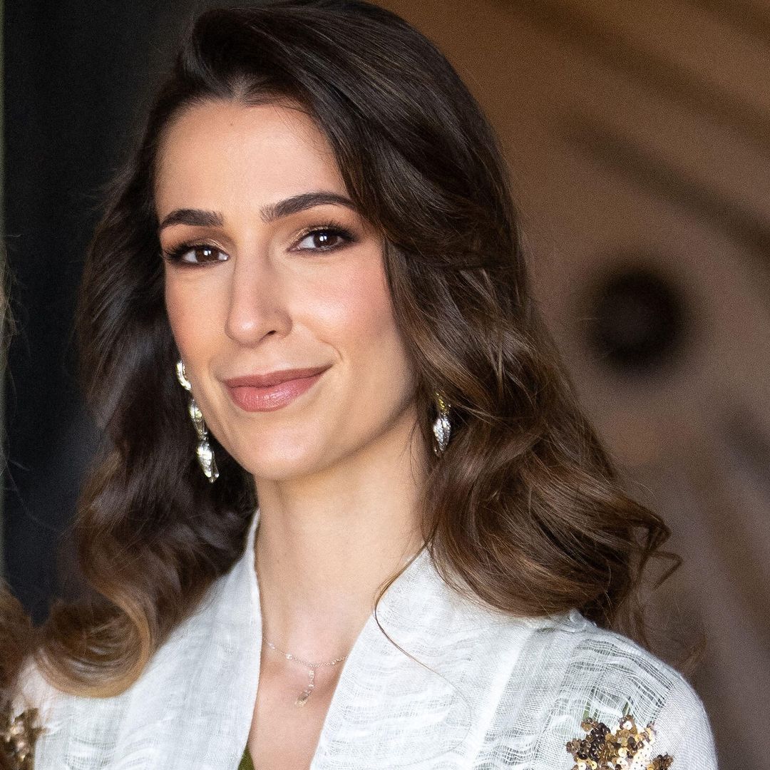 Princess Rajwa of Jordan displays blossoming baby bump in off-duty denim jumpsuit
