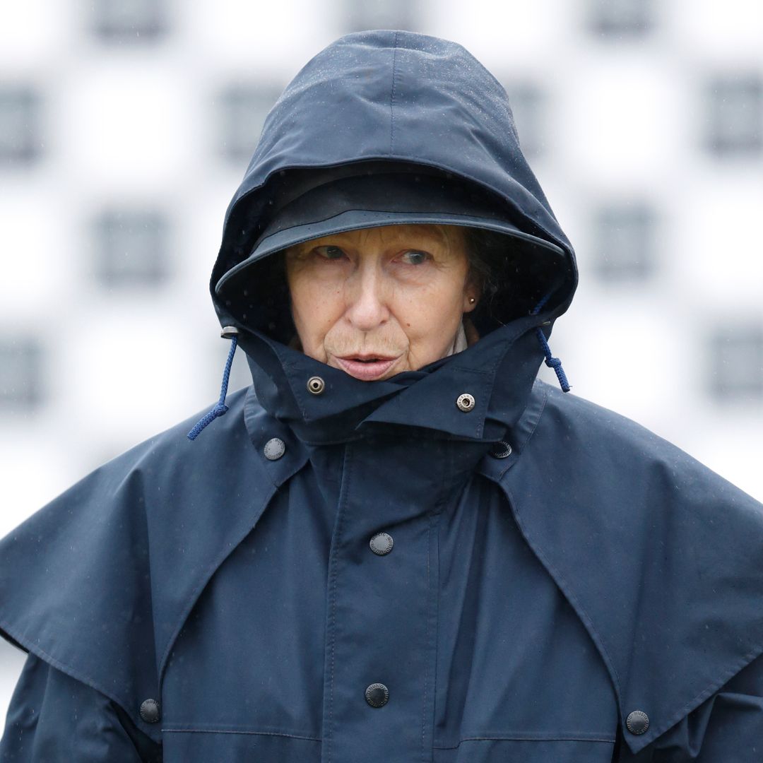 Spring showers are no match for Princess Anne as she braves rain in flared trousers and bold raincoat