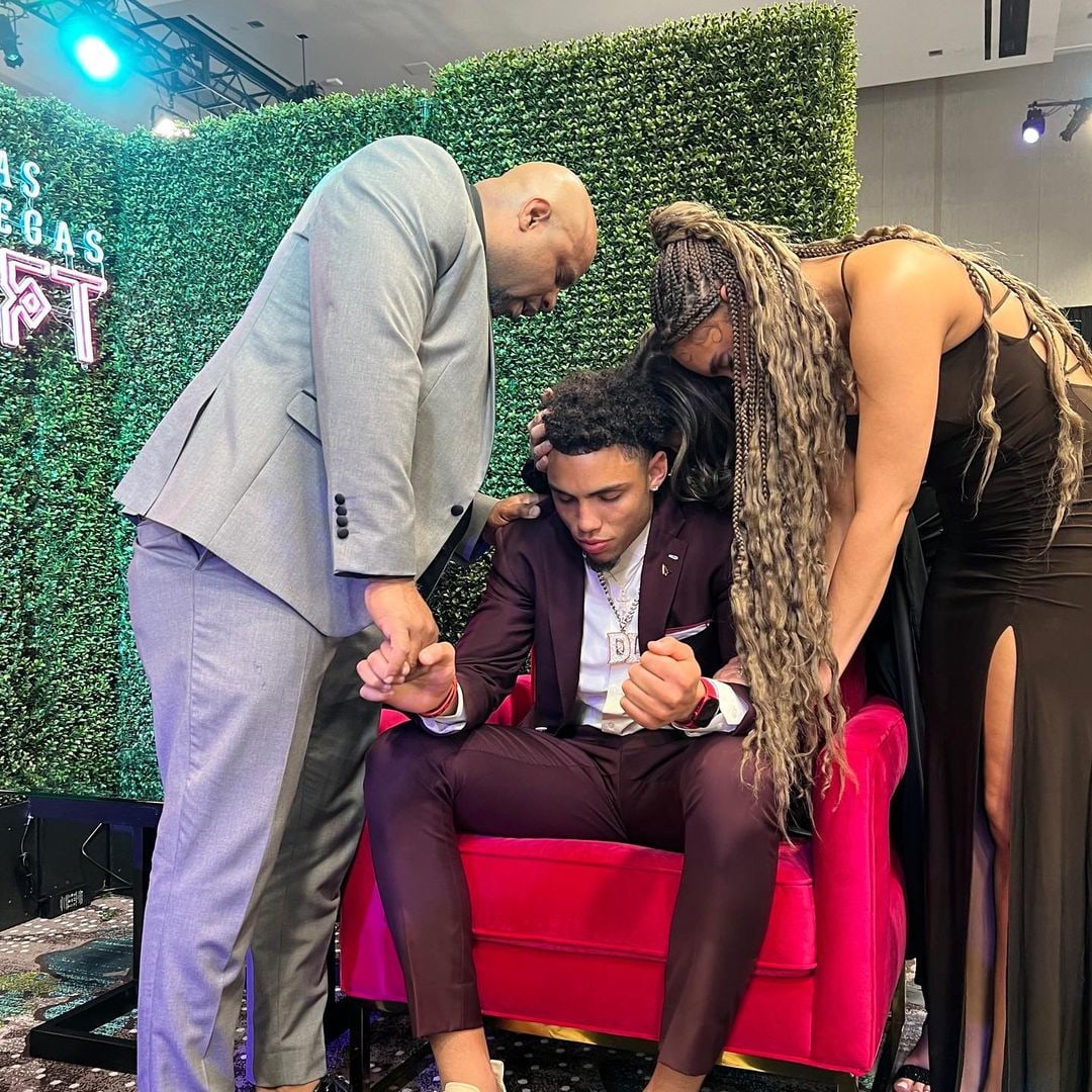 Drake London caught in a moment of prayer after his NFL draft in 2002 with parents Cindi and Dwan and sister Makayla, shared on Instagram