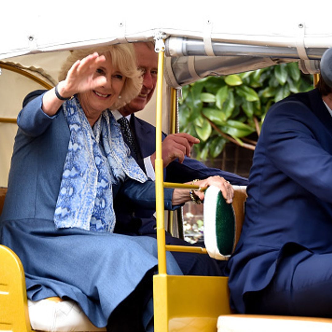 Prince Charles and Duchess Camilla ride off in a rickshaw race