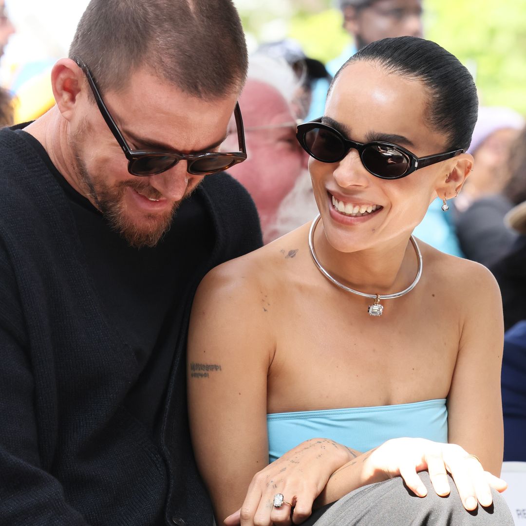 Channing Tatum in sunglasses sitting next to Zoe Kravitz