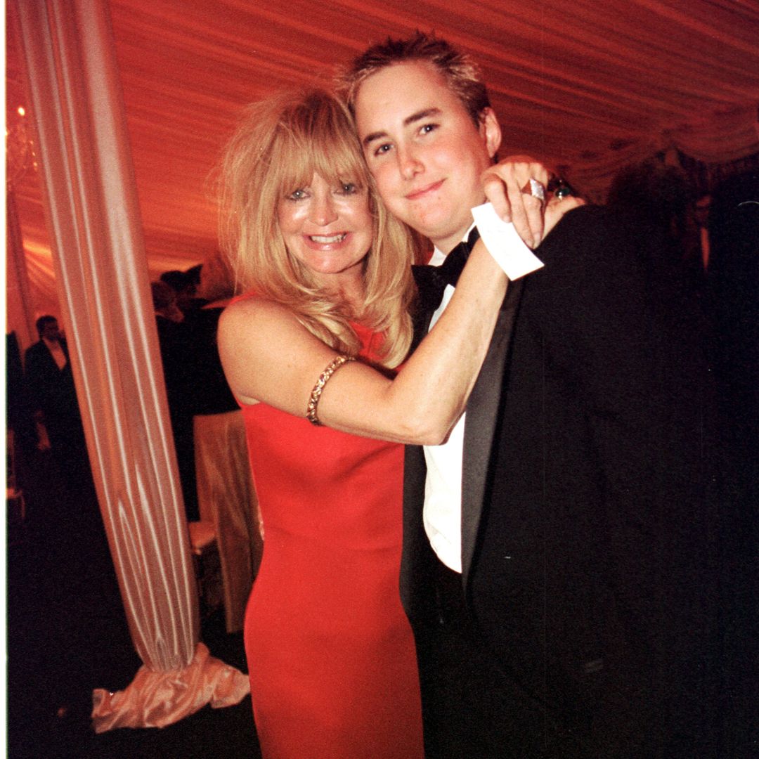 Actress Goldie Hawn hugs Boston Russell, son of her companion Kurt Russell, at the White House for an official dinner honoring Indian Prime Minister Atal Bihari Vajpayee September 17, 2000 in Washington, D.C