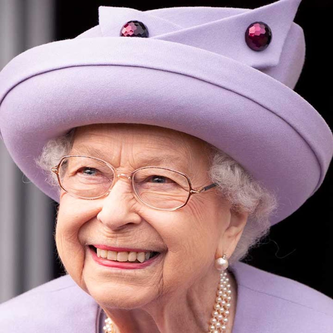 The Queen beams with joy as she presents George Cross to NHS representatives