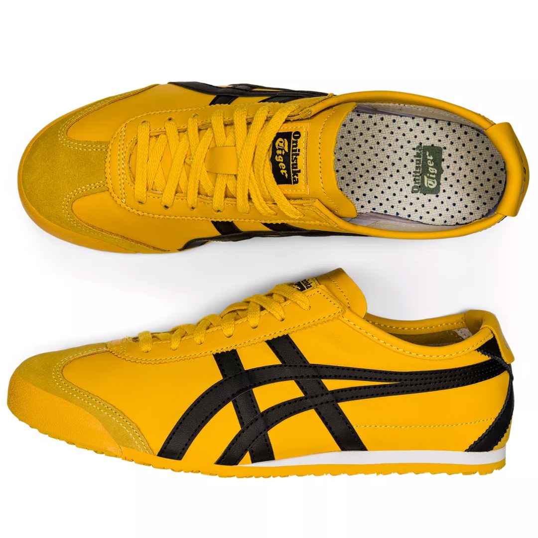 A pair of MEXICO 66 yellow sneakers photographed on a white background