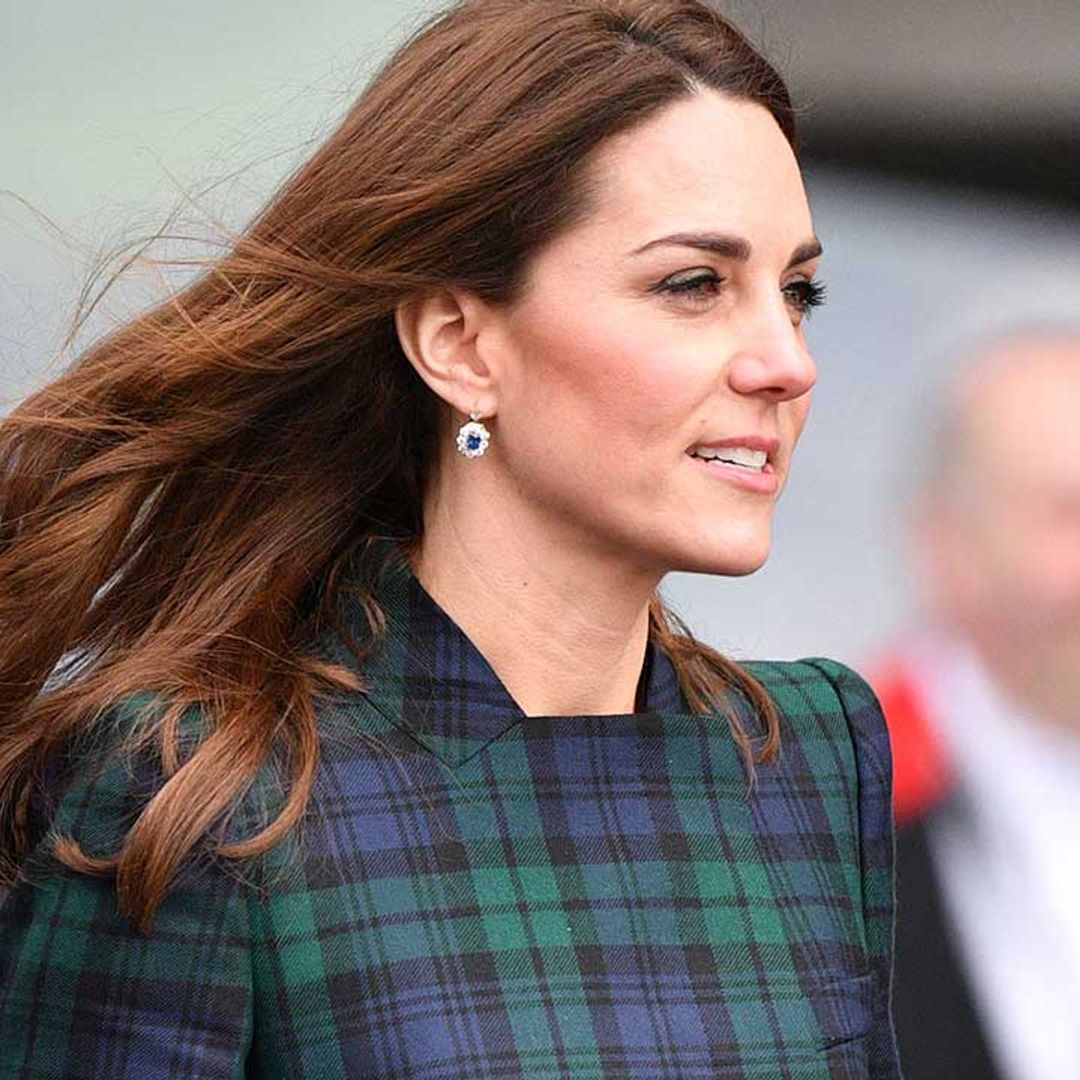 Kate Middleton braves the chilly weather wearing a tartan coat dress during a visit to Dundee