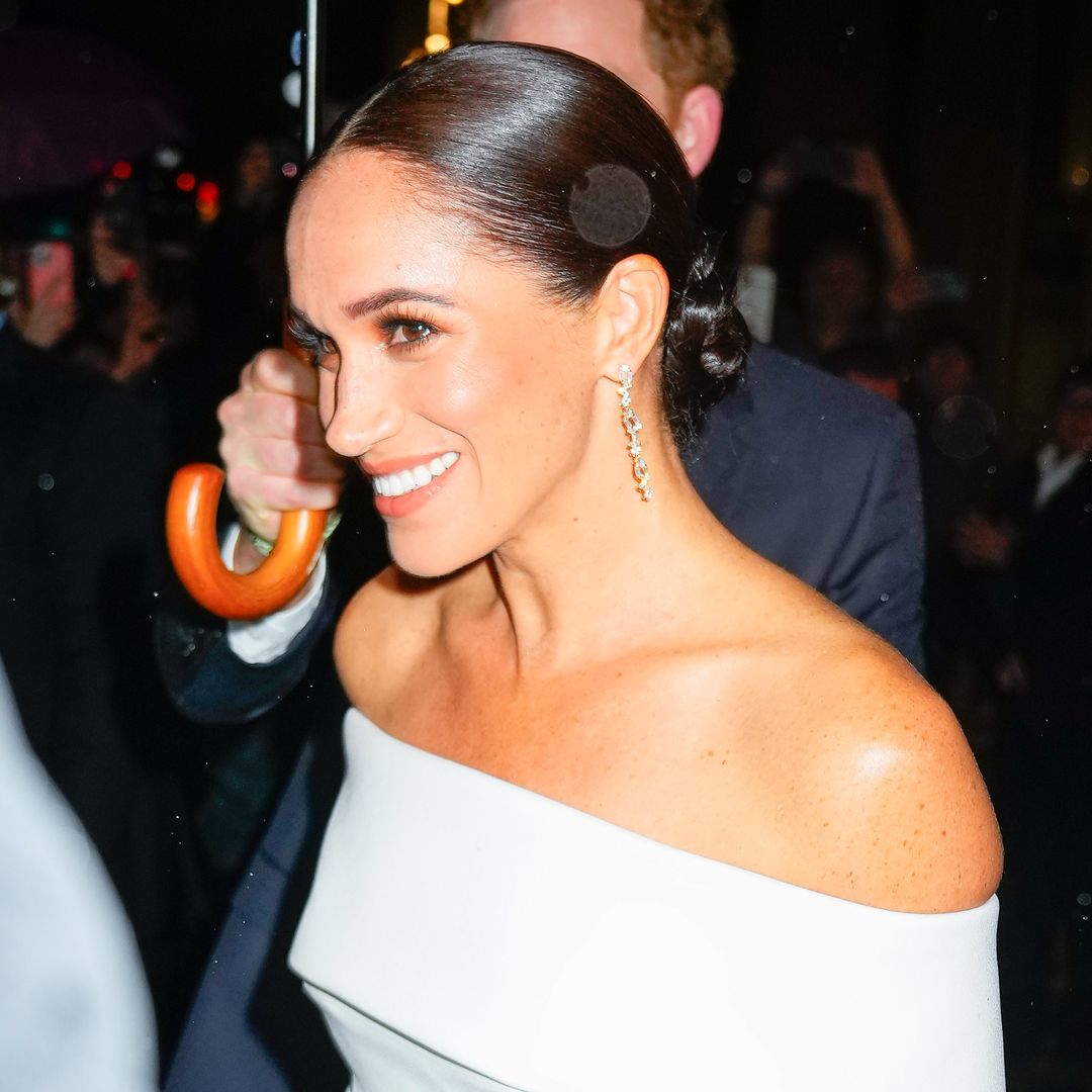 Meghan Markle is glowing and glamorous in nude turtleneck and silhouette-skimming flares