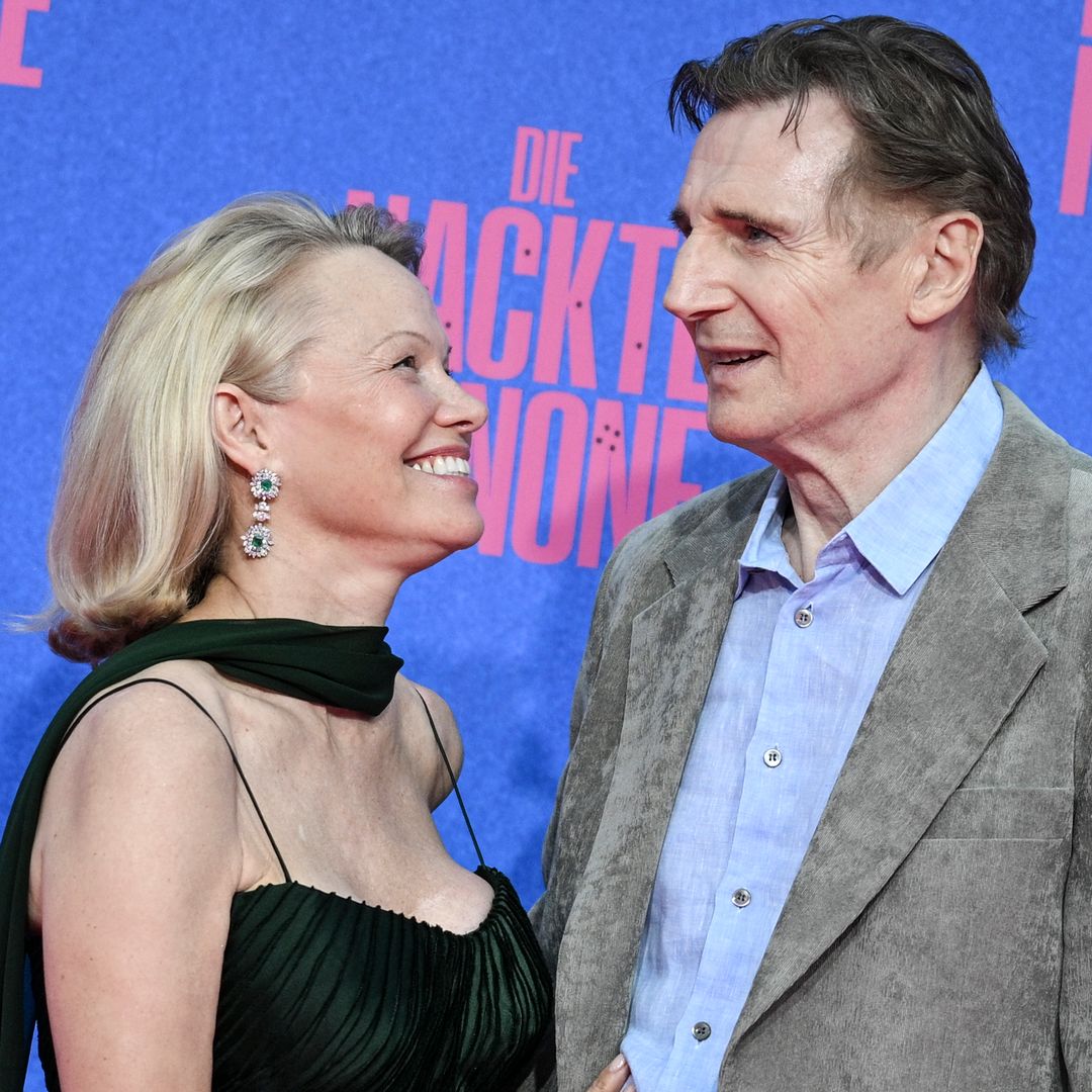 Liam Neeson turns up the romance with Pamela Anderson as they recreate iconic scene